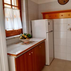 A kitchen or kitchenette at Appartamenti Cavataio 1