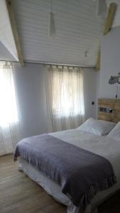 A bed or beds in a room at The Kingsley at Eversley 