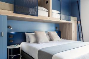 Posteľ alebo postele v izbe v ubytovaní Tuscany Hotel Alle Dune