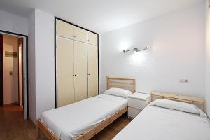 Ліжко або ліжка в номері Apartamentos Zodiac