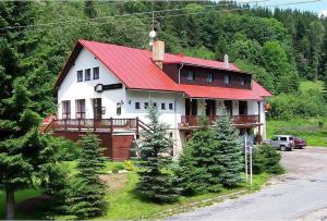 a large house with a red roof at Hotel Zdobnice in Rychnov nad Kněžnou