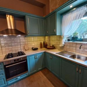 Kuchyň nebo kuchyňský kout v ubytování Villa Liberta