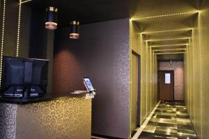 a lobby with a hallway with a television and a hallwayngthngthngthngthngth at 仔鹿 kojika in Nara