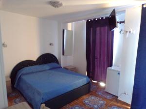 En eller flere senge i et værelse på NUOVA AURORA Rent Rooms