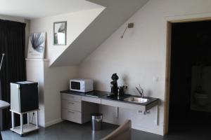 Kuchyň nebo kuchyňský kout v ubytování B&B Altijd Genieten