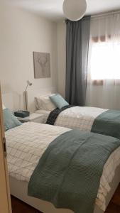 a bedroom with two beds and a window at JERUSALEM KING DAVID in Jerusalem +5 photos