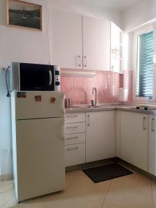 Kuchyňa alebo kuchynka v ubytovaní Apartment Dalma