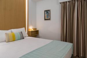 Postel nebo postele na pokoji v ubytování CHROMA Lodge Rafina