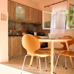 A kitchen or kitchenette at Maison Anna Corfu Holiday Apartments