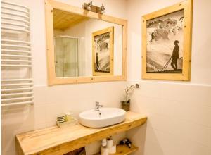a bathroom with a sink and a mirror at Villa Szymoszkowa SKI in Kościelisko