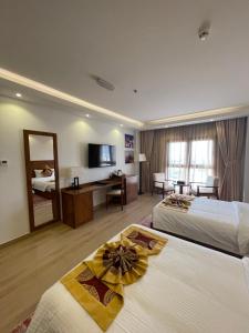 Katil atau katil-katil dalam bilik di Alsahwa Hotel