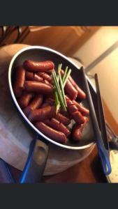 a bowl of sausages sitting on a table at Atrium Panzio in Esztergom