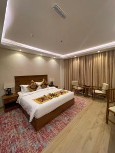 Katil atau katil-katil dalam bilik di Alsahwa Hotel