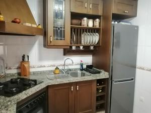 Kuchyň nebo kuchyňský kout v ubytování Bonita casa con piscina privada
