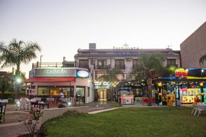 a building with a clock on the front of it at Hotel Casino Fortunata in Federación