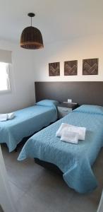 Posteľ alebo postele v izbe v ubytovaní Dptos equipados Gaudard