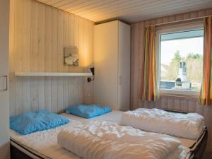 Postel nebo postele na pokoji v ubytování Holiday home Fanø CXVI