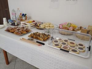 a table with many different types of pastries on it at IL CONTE DI MARRAONE in Agnone