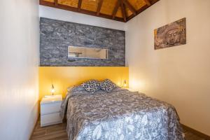 Ένα ή περισσότερα κρεβάτια σε δωμάτιο στο Recanto Jardim Do Mar