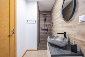 Ένα μπάνιο στο Recanto Jardim Do Mar