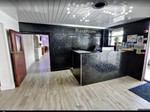 an office with a reception counter in a room at The County Hotel in Helensburgh