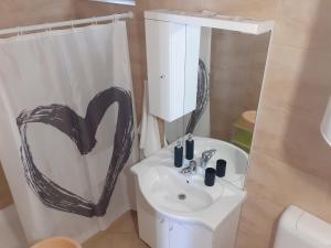 Kúpeľňa v ubytovaní Apartmani Sidro