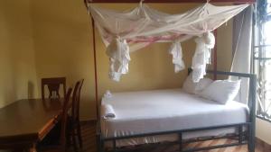 Ένα ή περισσότερα κρεβάτια σε δωμάτιο στο Farmhouse Lodge +3 φωτογραφίες
