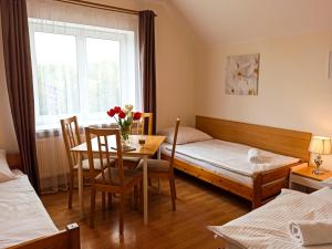 Posteľ alebo postele v izbe v ubytovaní Apartamenty i Pokoje u Doroty