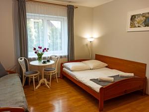 Posteľ alebo postele v izbe v ubytovaní Apartamenty i Pokoje u Doroty
