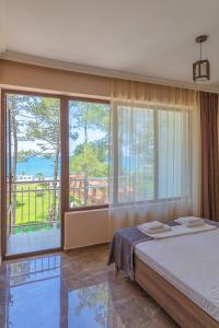 Postel nebo postele na pokoji v ubytování Samni Hotel