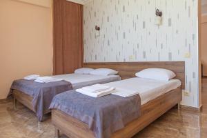 Postel nebo postele na pokoji v ubytování Samni Hotel
