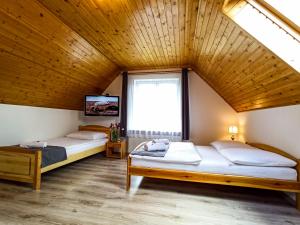 Posteľ alebo postele v izbe v ubytovaní Apartamenty i Pokoje u Doroty