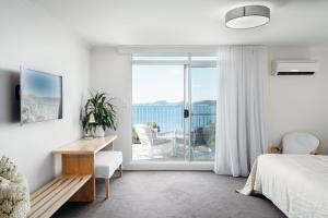 TV i/ili multimedijalni sistem u objektu Bannisters Port Stephens
