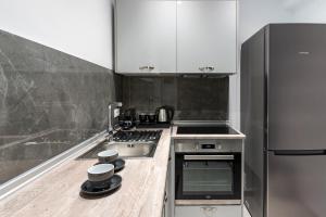Kuchyňa alebo kuchynka v ubytovaní POUNEDES LUXURY SUITES