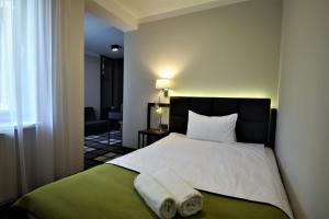 Postel nebo postele na pokoji v ubytování Hotel Impresja
