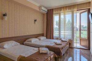 Postel nebo postele na pokoji v ubytování Samni Hotel + 37 fotografií