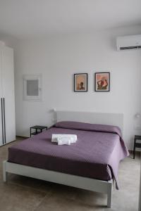Postel nebo postele na pokoji v ubytování Villa Vannì