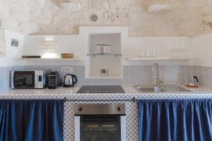 A kitchen or kitchenette at HelloApulia - Trulli Le Murge