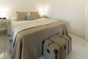 A bed or beds in a room at HelloApulia - Trulli Le Murge