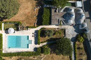The swimming pool at or close to HelloApulia - Trulli Le Murge