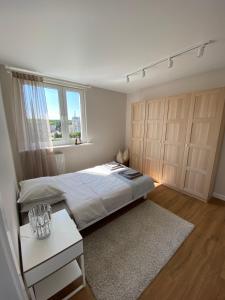 Posteľ alebo postele v izbe v ubytovaní Apartament Narcyzowa