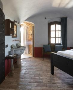 Posteľ alebo postele v izbe v ubytovaní Rocca di Arignano