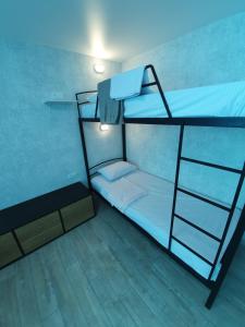 a bunk bed with a ladder in a room at Silver 2 Затока in Zatoka
