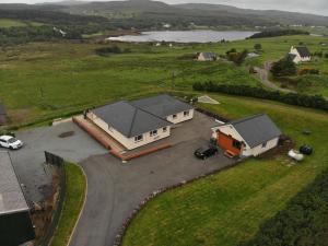 an aerial view of a house with a parking lot at Skeabostview B&B in Skeabost