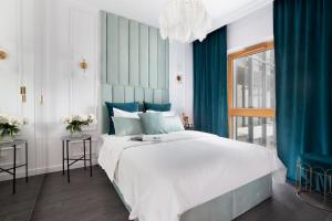 Posteľ alebo postele v izbe v ubytovaní Elite Apartments Nadmotławie Prestige