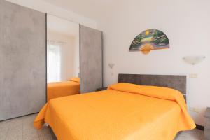 Postel nebo postele na pokoji v ubytování Appartamento Tamma 1 - HelloElba