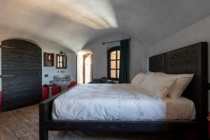 Posteľ alebo postele v izbe v ubytovaní Rocca di Arignano