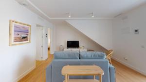 Телевизор и/или развлекательный центр в Apartamentos La Casa El Palo