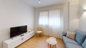 Телевизор и/или развлекательный центр в Apartamentos La Casa El Palo