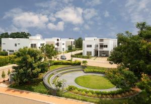an aerial view of a row of white houses at Spree Resort At Century Wintersun in Dod Ballāpur